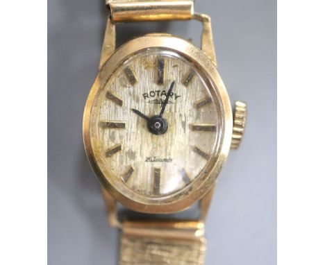 A lady's 9ct gold Rotary manual wind wrist watch, on a 9ct gold strap, case diameter 15mm, gross 18.8 grams.CONDITION: Dial g