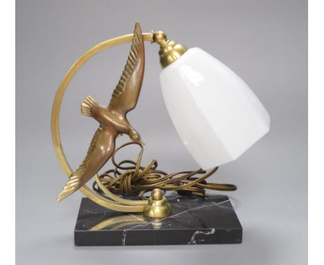 A French Art Deco 'seagull' table lamp, on marble base, stamped bronze, height 26cmCONDITION: Good condition including glass 