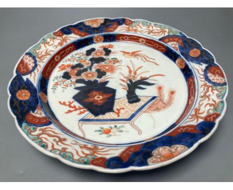 A 19th century Imari dish, painted in typical palette, 30.5cm diameterCONDITION: There is slight wear to gilding in places bu
