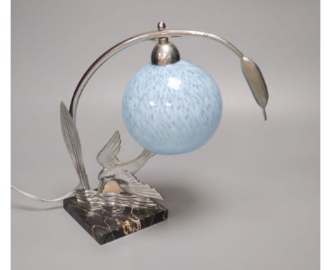 An Art Deco chrome kingfisher table lamp, on marble base with pale blue glass shade