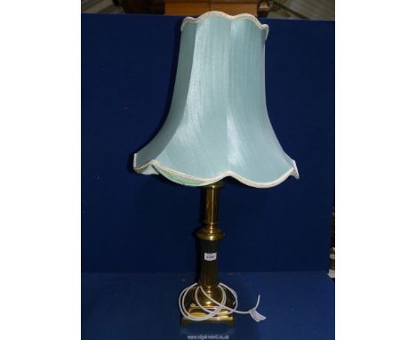 A brass table lamp, square based with duck egg blue shade, 20" tall excluding bulb and shade.