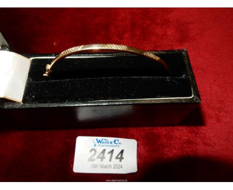 A cased 9ct Bangle, maker A.C.
