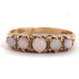 A 9ct opal ring, set with five graduated round opal cabochons, claw mounted with scrolled gallery