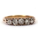 A five stone diamond ring, the five graudated old mine cut diamonds, total estimated approx. 1.