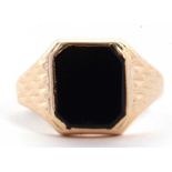 A 9ct onyx ring, the squared onyx in rubover mount with tapered shoulers with diamond pattern, plain