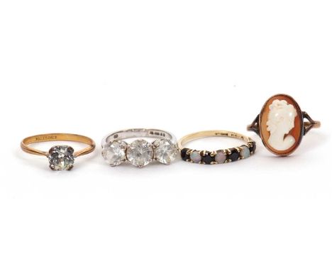 Four gemset rings: to include a 9ct opal and sapphire ring, hallmarked Birmingham 1985, size L, 1.3g; a 9ct three stone white
