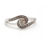A 9ct diamond ring, set to centre with four small round diamonds, with an asymetric sweep of