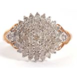 A 9ct diamond cluster ring, the tiered cluster comprised of small round brilliant cut diamonds,