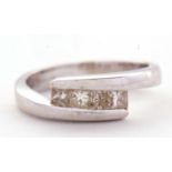 An 18ct white gold four stone diamond ring, the four princess cut diamonds, total estimated