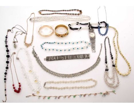 A mixed lot of costume jewellery, to include a Corocraft wristwatch, a gilt metal and blue paste bangle, crystal beads, brooc