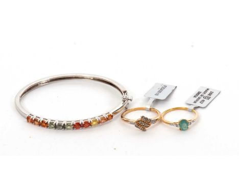 Two 9ct rings and a gemset ring: to include an oval emerald and diamond ring stamped 10K and 375 and hallmarked Birmingham 20