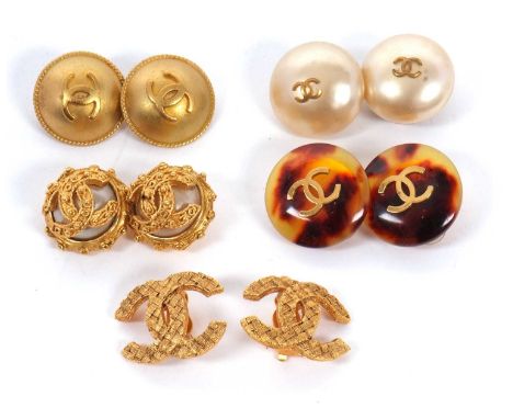 Five pairs of Chanel earclips, the gilt metal earrings all with CC logo, all between 20 - 25mm diameter, (5)  rubber backs ha