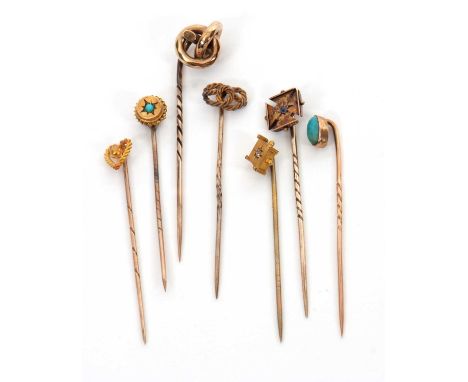 Seven various stick pins, to include a knotted pin stamped 15ct, a pale blue stone cross pin stamped 15, two turquoise pins a