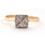 An Edwardian diamond ring, the square plaque set with four single cut diamonds, with plain
