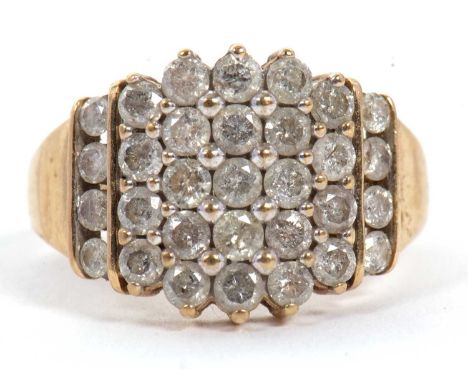 A 9ct diamond ring, set with five graduated columns of round brilliant cut diamonds, with a further four round brilliant cut 