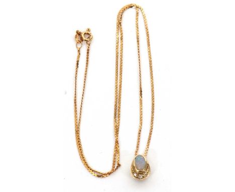A 9ct opal and diamond pendant necklace, the oval opal cabochon in a pear shape mount with diamond highlights below, with She