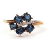 A 9ct blue stone and diamond ring, the leaf shape ring set with five oval blue stones (probably