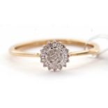 A 9ct diamond cluster ring, set wtih small round brilliant and baguette cut diamonds, total