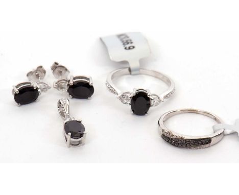 A black and white diamond ring, size O, together with a black and white gemstone and silver ring, size R, with matching earri