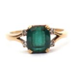 A 9ct green tourmaline ring, the mixed cut tourmaline with four diamond highlights, claw mounted