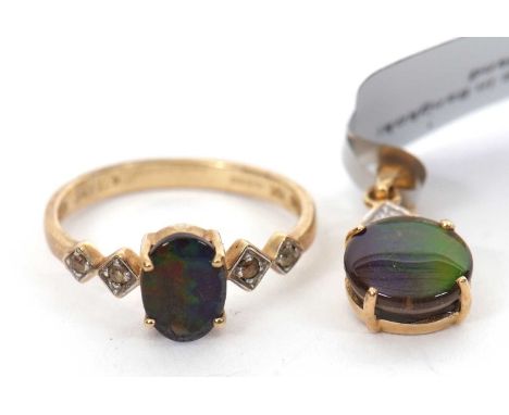 A 9ct opal triplet ring and a matching 10K pendant, the oval opal triplet in a four claw mount with two white stone highlight
