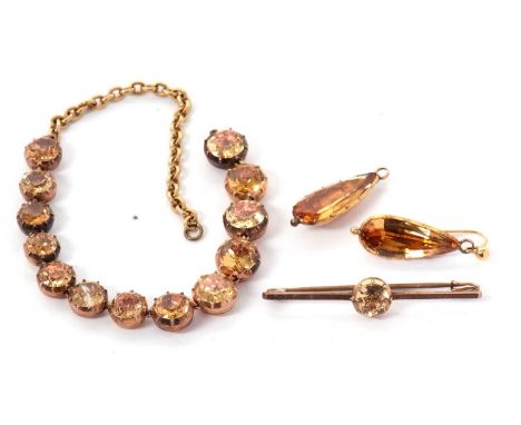 A part suite of Georgian foil backed topaz jewellery, to include a pair of pear shape drop earrings, 23mm long, a part neckla