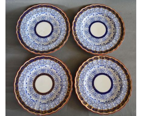 A Set of Four 19th Century Worcester Porcelain Plates decorated in underglaze blue, highlighted with gilt 