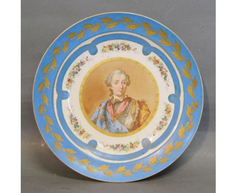 A Sevres Porcelain Large Dish hand painted with a portrait of Louis XV with powder blue and gilded border, 30cms diameter 