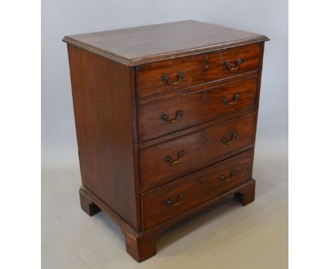 A 19th Century Mahogany Commode Chest, the moulded top above a fall front simulated as two drawers above two drawers with swa
