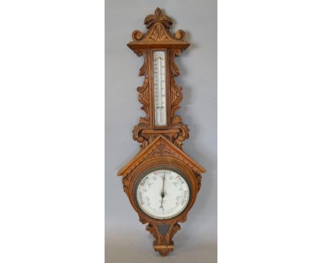 A Victorian Oak Barometer Thermometer, the enamel dial inscribed Benet Fink & Company, London, 97cms tall 