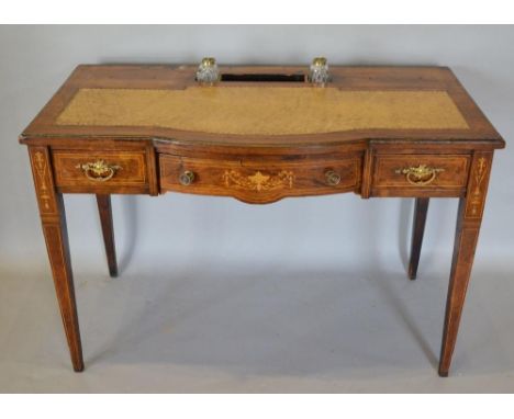 An Edwardian Rosewood Marquetry Inlaid Semi-Bow Fronted Writing Desk, the tooled leather inset top with two glass inkwells an