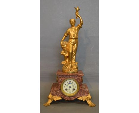 A French Rouge Marble and Gilt Metal Mantle Clock, the figural surmount depicting a boy holding a bird titled La Cueillette u