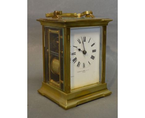 A French Brass Cased Carriage Clock, the enamel dial with Roman numerals and inscribed Alexander Clark Co. Ltd. Paris with le