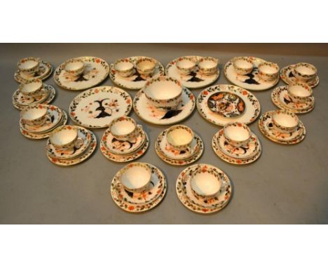 A Royal Crown Derby tea service, comprising cups and saucers, plates side plates and sugar bowl, all decorated in the Imari p