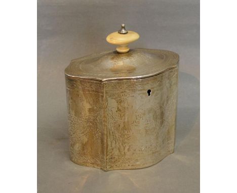 A Victorian Silver Tea Caddy of Serpentine Form, the hinged cover with ivory finial above an engraved body with crest, London