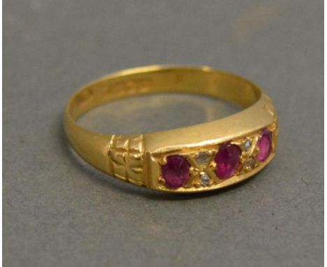 An 18ct. Yellow Gold Three Stone Ruby Ring 