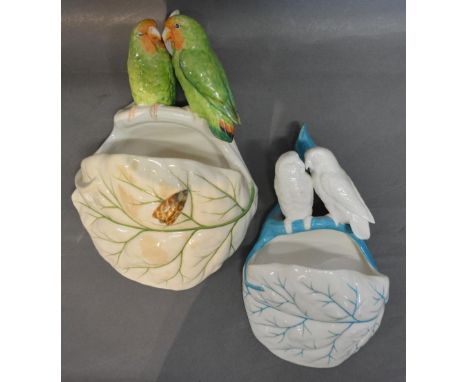 A Royal Worcester Porcelain Wall Pocket with Bird Surmount, together with another similar Royal Worcester Wall Pocket 