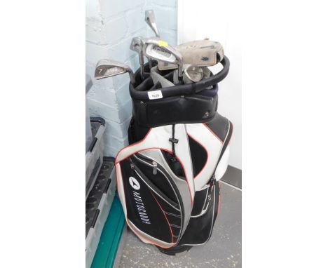 A Moto Caddy golf bag, containing various Ping golf clubs.
