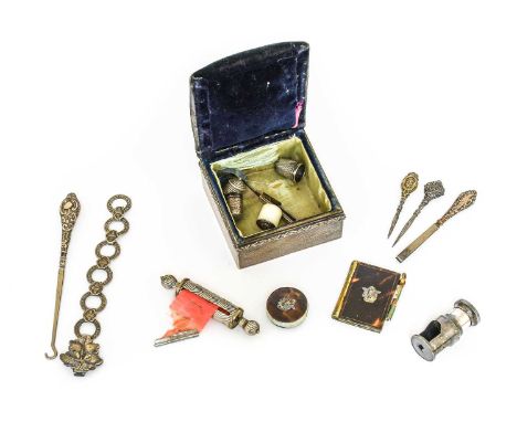 Silver and Other Sewing Accessories and Tools comprising a hinged box with silver base with velvet mount and silk lining,silv