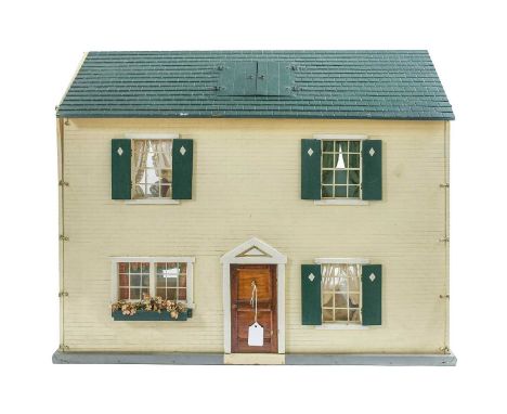 American Mid-20th Century Tynietoy Dolls House with a cream painted brick facade, green wooden shutters, four windows with pa