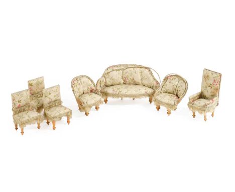 A Suite of Early 20th Century Dolls House Furniture comprising a sofa, two open armchairs and four dining chairs upholstered 