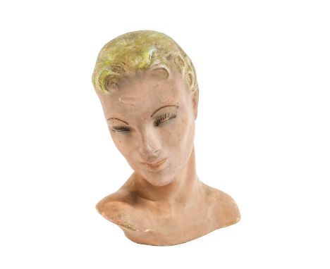 A Circa 1930s Papier Mache Millinery Mannequin Head of a stylised lady with moulded blonde hair, painted face, 36cm by 30cm