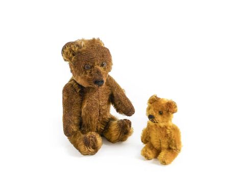 An Early 20th Century Schuco Brown Plush Miniature Bear with glass atomiser, black button eyes, stitched nose, jointed body, 