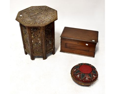 A 1930s oak side table with tapestry and glass insert top, together with a carved Indian folding table profusely decorated wi