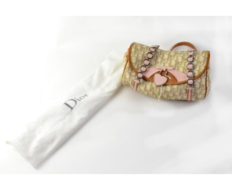 CHRISTIAN DIOR; a 'Diorissimo Trotter Romantique' beige and cream coated canvas bag with pink and tan calfskin leather trim, 
