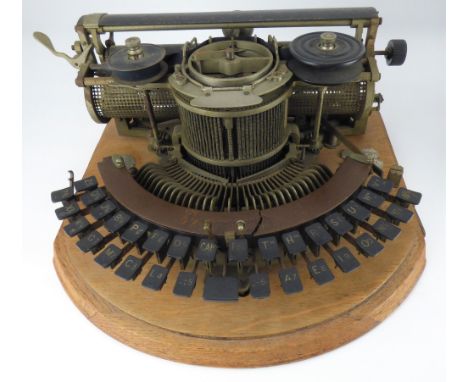 THE HAMMOND; a vintage typewriter with curved keyboard, on wooden mount and in wooden case.