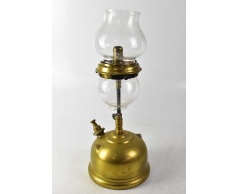 An unusual vintage brass paraffin lamp with two globular shades, height 43cm.