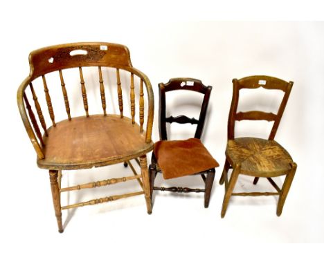 A 19th century children's chair with bergère seat, another with a woven rush seat and an early 20th century stick back open a