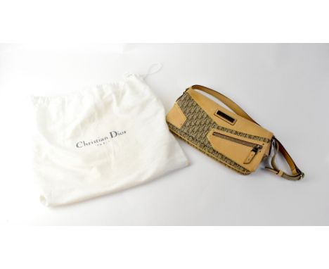 CHRISTIAN DIOR; a 'Diorissimo' brown canvas envelope bag with tan calfskin leather trim and leather and fabric strap, with wh