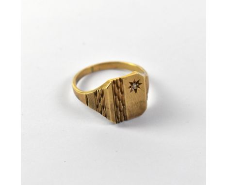 A gentlemen's vintage 9ct gold signet ring with square top, chamfered corners and star set tiny diamond, on patterned shoulde